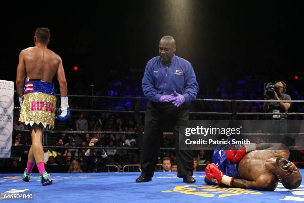 Prichard Colon walks to a corner as Terrel Williams falls to the ring in their super welterweights bout at EagleBank Arena on the campus of George...