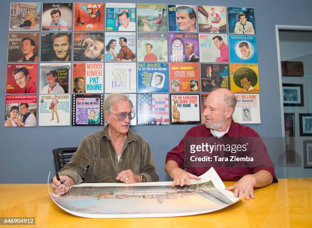 Singer Pat Boone and President of the Jewish American Society for Historic Preservation Jerry Klinger sign a 70th Anniversary Commemorative print...