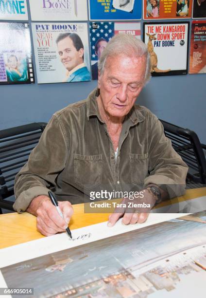 Singer Pat Boone signs a 70th Anniversary Commemorative print honoring the Exodus shipÕs contribution to Jewish and world history at Pat Boone...
