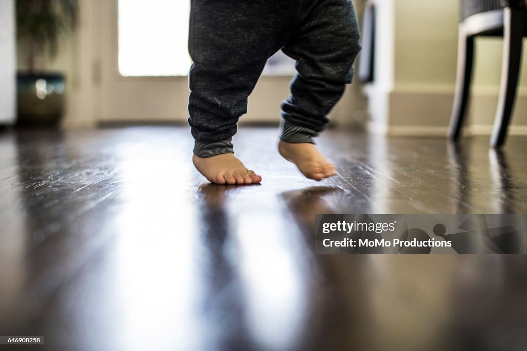 Closeup of toddler taking first steps