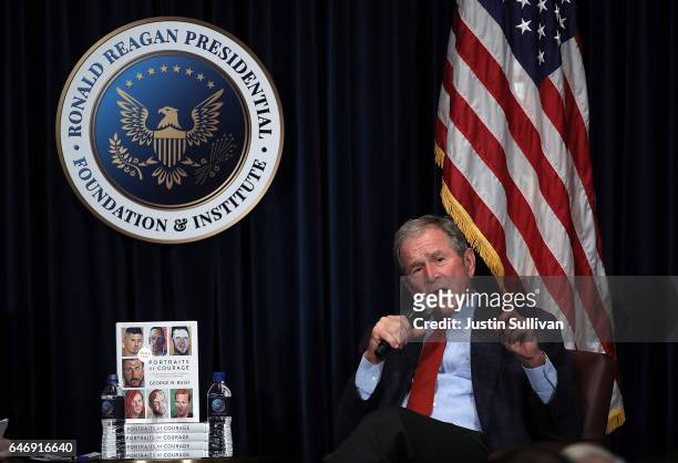 Former U.S. President George W. Bush speaks during a discussion about his new book "Portraits of Courage: A Commander in Chief's Tribute to America's...