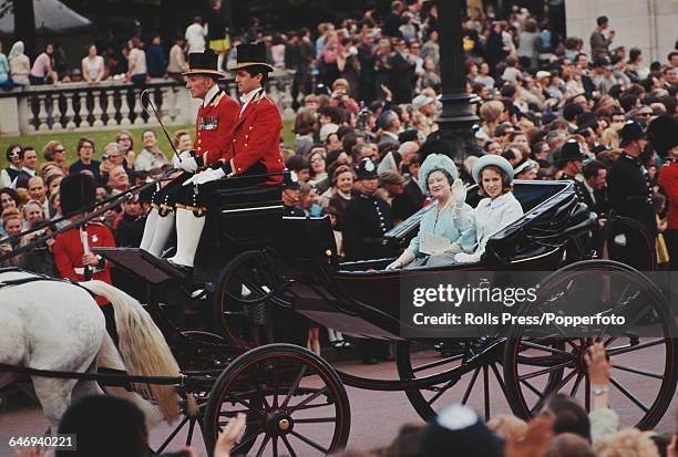 Princess Anne and Queen Elizabeth The Queen Mother ride together in an open landau horse drawn coach past the Victoria Memorial at the end of The...