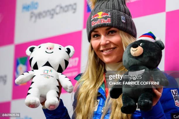 Lindsey Vonn of the US poses with the two Pyeongchang 2018 mascots during a press conference following the first women's downhill practice during a...