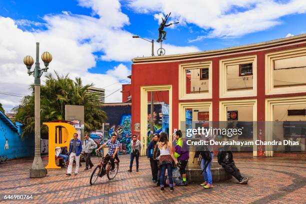 bogota, colombia - tourists and local people on plaza chorro de quevedo in the la candelaria district - plaza del chorro de quevedo stock pictures, royalty-free photos & images