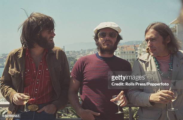 From left, American actors Peter Fonda, Jack Nicholson and Dennis Hopper pictured together holding galsses of white wine in Cannes, France to promote...