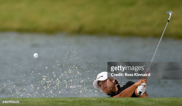 Haru Nomura, of Japan plays her second shot on the par three 15th hole during the first round of the HSBC Women's Champions on the Tanjong course at...