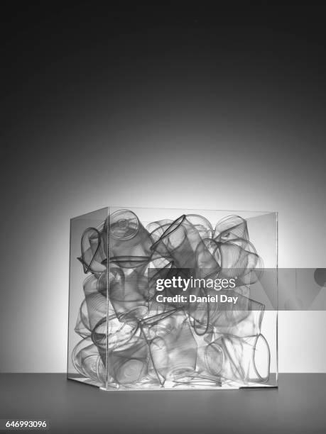 transparent plastic cups in a perspex cube - perspex cube stock pictures, royalty-free photos & images