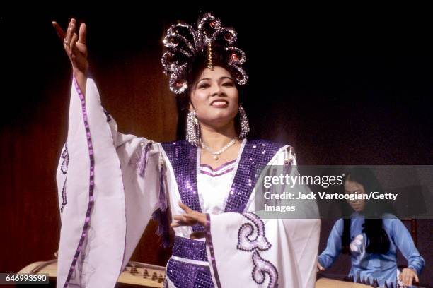 Vietnamese Cai Luong actress and singer Phuong Dzung performs with the Lam Ensemble at a Society for Asian Music concert in the Metropolitan Museum...