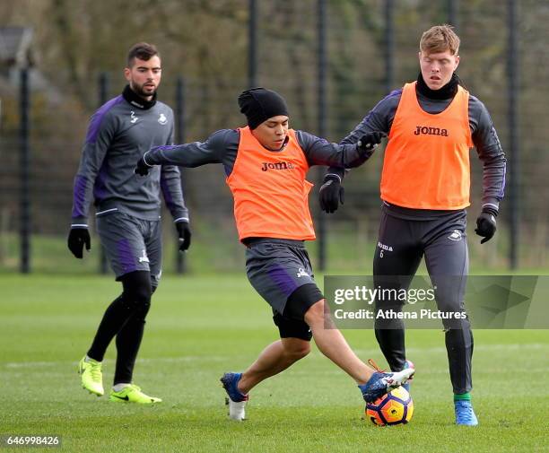 Jefferson Montero against Alfie Mawson during the Swansea City Training at The Fairwood Training Ground on March 1, 2017 in Swansea, Wales.