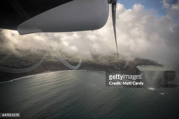 Skybus plane begins flying from Lands End airport on the mainland in Cornwall over Sennen Cove and Lands End on February 16, 2017 in Cornwall,...