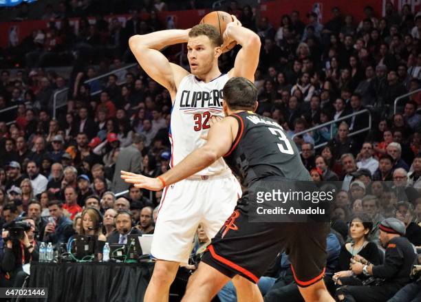 Blake Griffin of Los Angeles Clippers in action against Ryan Anderson of Houston Rockets during the NBA match between Los Angeles Clippers and...