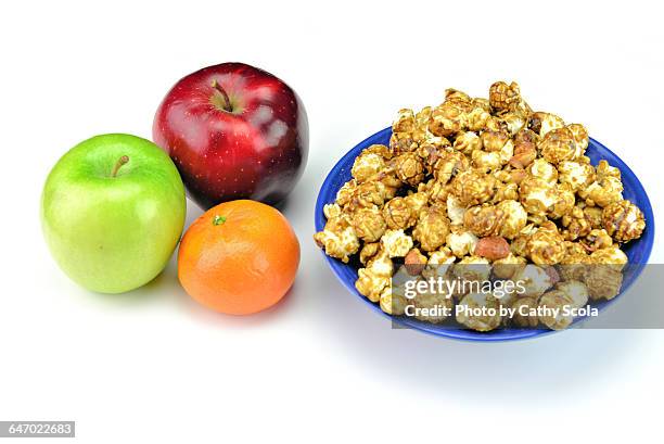healthy vs. unhealthy - caramel popcorn stock pictures, royalty-free photos & images