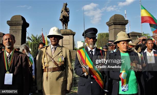 Ethiopian veteran man and woman, wearing military uniform and medals, stand next to each other during the celebration of the 121st Anniversary of...