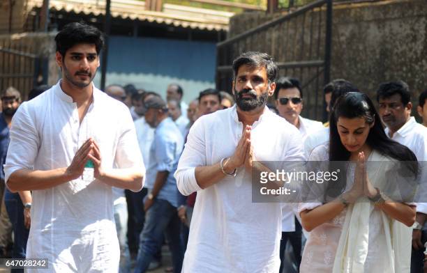 Indian Bollywood actor Suniel Shetty , with his son Ahan and wife Mana , attend the funeral of his father Veerappa Shetty in Mumbai on March 2, 2017....
