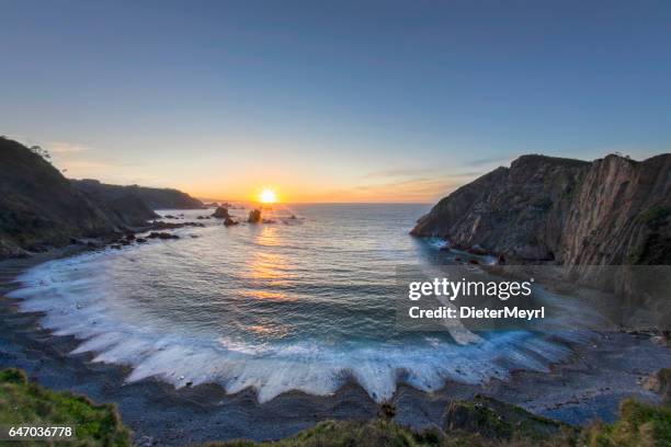 sunset on the el silencio bay of biscay - asturias stock pictures, royalty-free photos & images