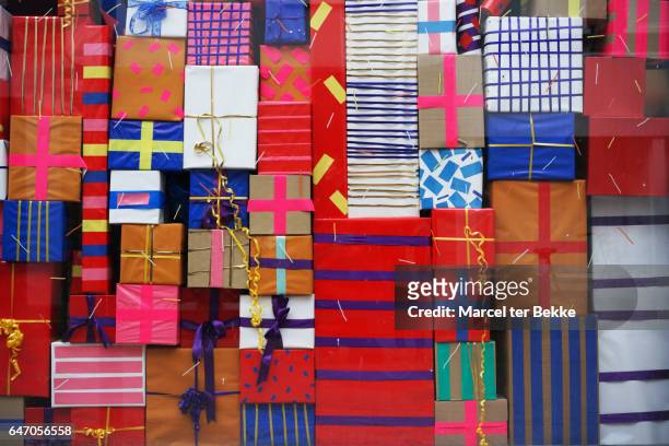 wall of presents - large group of objects stock pictures, royalty-free photos & images