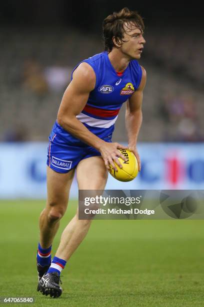 Liam Picken of the Bulldogs looks upfield during the 2017 JLT Community Series AFL match between the Western Bulldogs and the Brisbane Lions at...