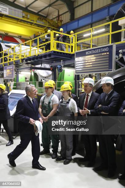German President Joachim Gauck greets workers and executives during a visit by Gauck to the Siemens gas turbine factory on March 2, 2017 in Berlin,...