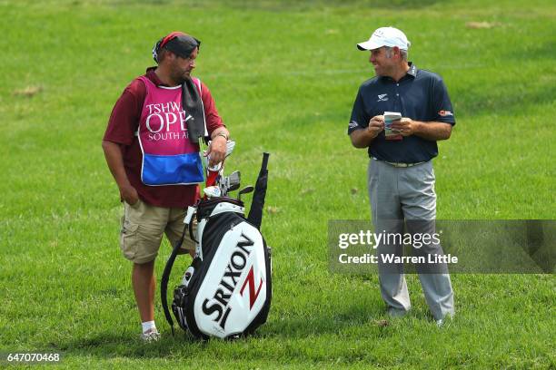 Hennie Otto of South Africa chats with his caddie during Day One of The Tshwane Open at Pretoria Country Club on March 2, 2017 in Pretoria, South...