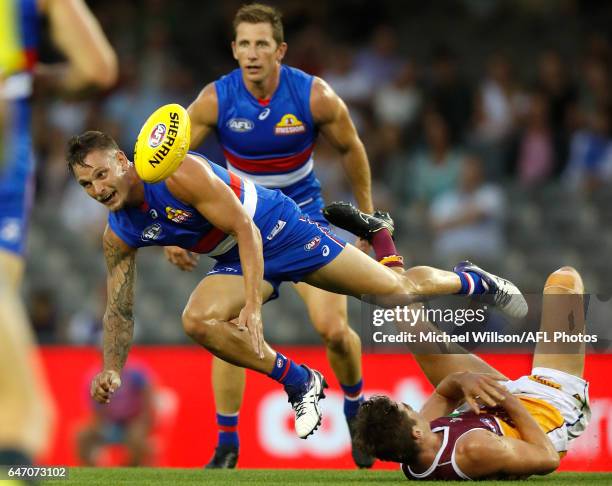 Clay Smith of the Bulldogs and Ben Keays of the Lions compete for the ball during the AFL 2017 JLT Community Series match between the Western...