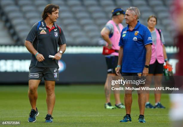 Luke Beveridge, Senior Coach of the Bulldogs and Chris Fagan, Senior Coach of the Lions chat during the AFL 2017 JLT Community Series match between...