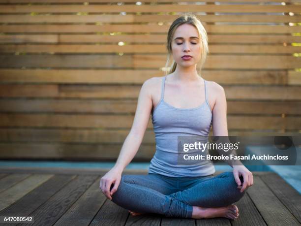 woman doing yoga - 2017 20 stock pictures, royalty-free photos & images