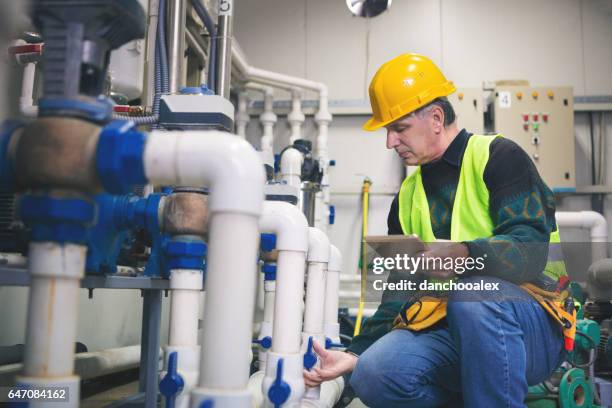 technician checking the system - pipe smoking pipe stock pictures, royalty-free photos & images