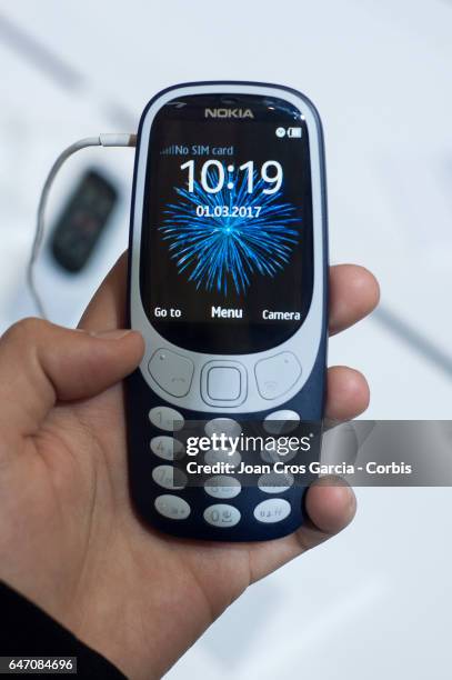 Congress attendee testing the new remake of Nokia 3310, during the Mobile World Congress, on March 1, 2017 in Barcelona, Spain.