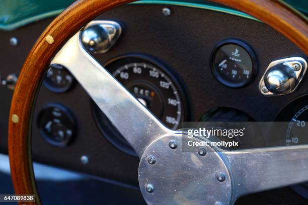 steering wheel collectors car sports car aston martin - mollypix stock pictures, royalty-free photos & images