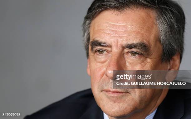 French presidential election candidate for the right-wing Les Republicains party Francois Fillon takes part in a lunch with winegrowers during a...