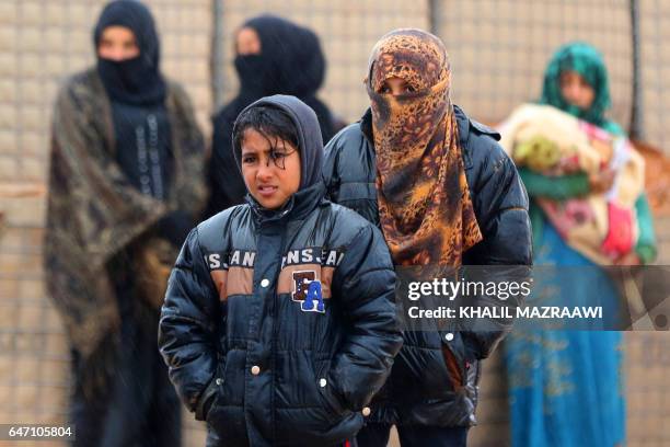 Syrian refugee patients from the makeshift Rukban camp, which lies in no-man's-land off the border between Syria and Jordan in the remote northeast,...