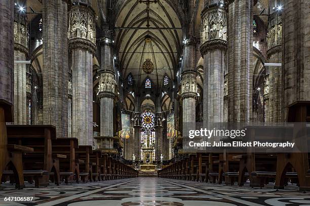 the duomo di milano or milan cathedral, italy. - catedral interior fotografías e imágenes de stock