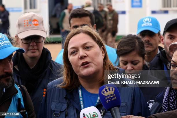 Maeve Murphy, Senior operations Manager from UNHCR, speaks to journalists in front of the UN-operated Rukban medical center near the Jordan-Syria...