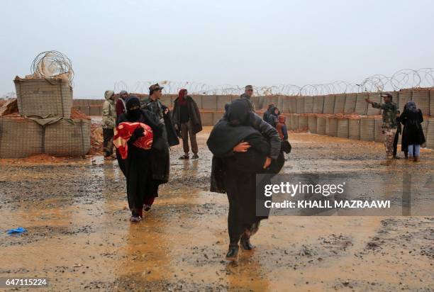Syrian refugee patients from the makeshift Rukban camp, which lies in no-man's-land off the border between Syria and Jordan in the remote northeast,...