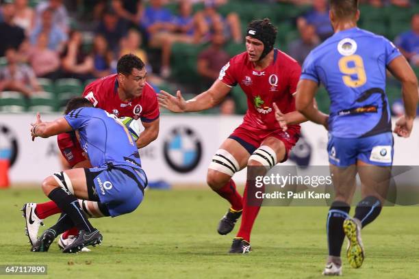 George Smith of the Reds gets tackled by Kane Koteka of the Force during the round two Super Rugby match between the Western Force and the Reds at...