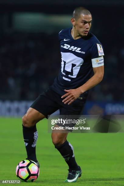 Dario Veron of Pumas drives the ball during the quarterfinals second leg match between Pumas UNAM and Tigres UANL as part of the CONCACAF Champions...