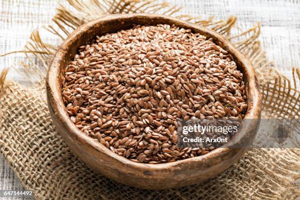 linseeds or flax seeds in a bowl - graine de lin photos et images de collection