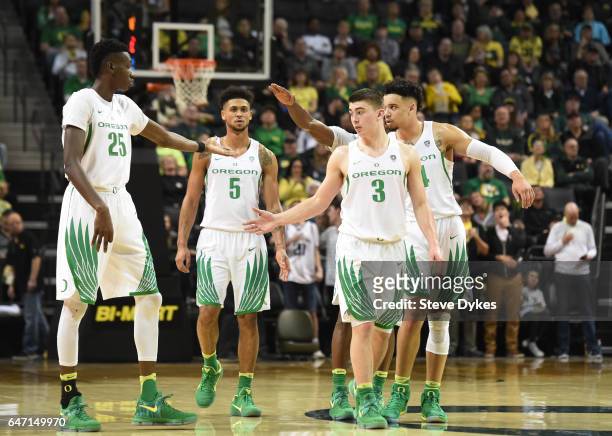 Chris Boucher, Tyler Dorsey, Dillon Brooks and Payton Pritchard of the Oregon Ducks walk onto the court in the second half of the game against the...