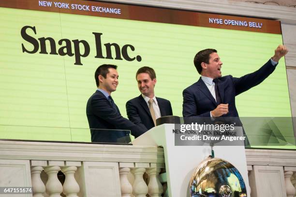 Snapchat co-founders Bobby Murphy, chief technology officer of Snap Inc., and Evan Spiegel, chief executive officer of Snap Inc., ring the opening...