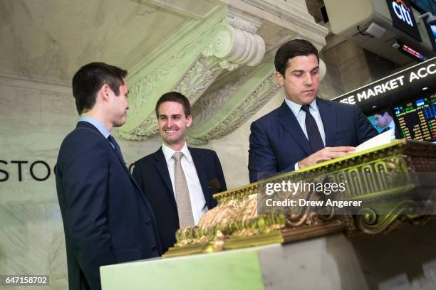 Snapchat co-founders Bobby Murphy, chief technology officer of Snap Inc., and Evan Spiegel, chief executive officer of Snap Inc., prepare to sign a...