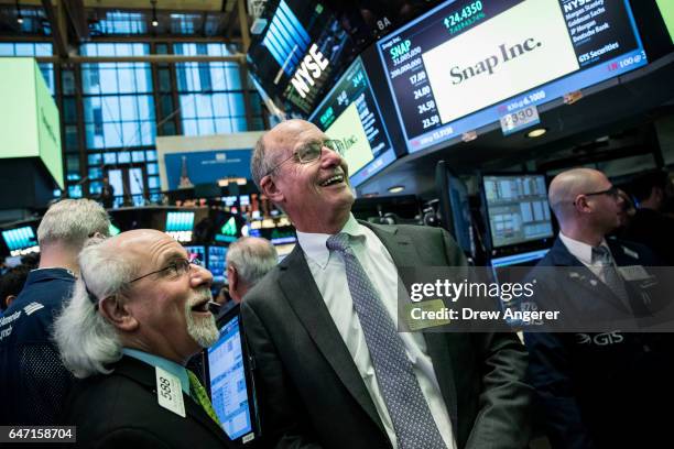 John Spiegel , father of Snapchat founder Evan Spiegel, reacts as Snap Inc. Shares open for trading on the floor of the New York Stock Exchange ,...