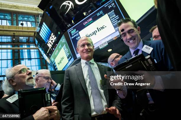 John Spiegel , father of Snapchat founder Evan Spiegel, reacts as Snap Inc. Shares open for trading on the floor of the New York Stock Exchange ,...