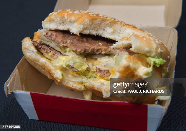 Photo of a partially eaten McDonalds' Big Mac hamburger November 2, 2010. AFP Photo/Paul J. Richards / AFP PHOTO / Paul J. Richards