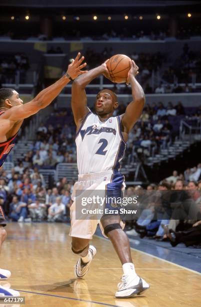 Mitch Richmond of the Washington Wizards moves to pass the ball during the game against the New York Knicks at the MCI Center in Washington, D.C. The...