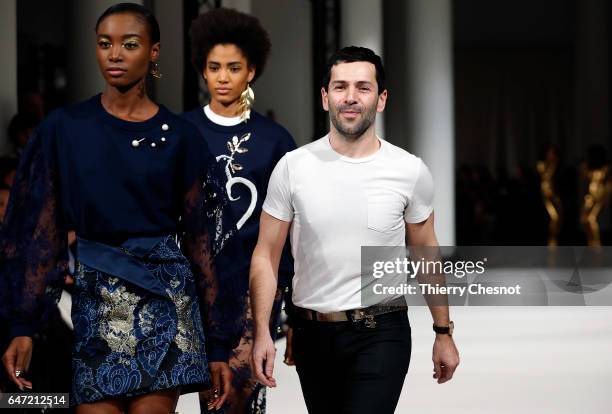 French designer Alexis Mabille acknowledges the audience after presenting his Fall/Winter 2017/18 Ready to Wear collection during the Paris Fashion...