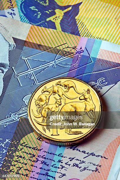 australian dollar coin on bank notes - australian coin stock pictures, royalty-free photos & images