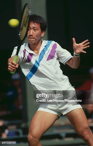 American tennis player Michael Chang pictured in action competing to reach the fourth round in the Men's Singles tournament at the Wimbledon Lawn...