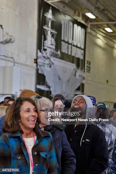 Members of the Navy and shipyard employees wait for President Donald Trump to speak abroad the aircraft carrier Gerald R. Ford CVN-78 at Newport News...