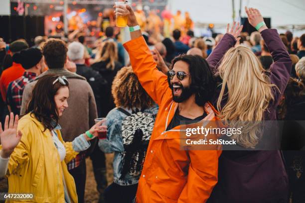 festival fun - music festival dancing stock pictures, royalty-free photos & images