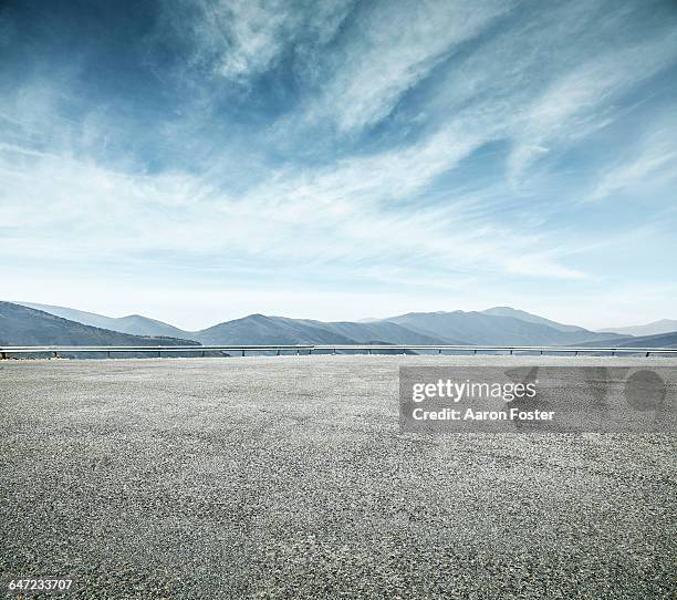 open parking lot - karge landschaft stock-fotos und bilder